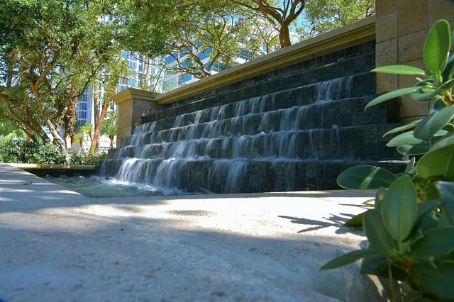 a view of outdoor space with swimming pool and trees in the background