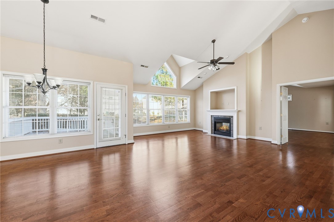 102 Creek Point Court Colonial Heights, VA 23834 - Photo 11 of 45 a view of an empty room with wooden floor and a window