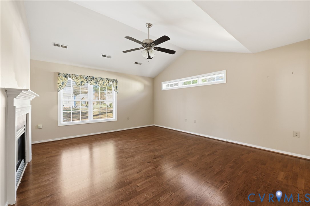 102 Creek Point Court Colonial Heights, VA 23834 - Photo 14 of 45 a view of an empty room with a window and wooden floor