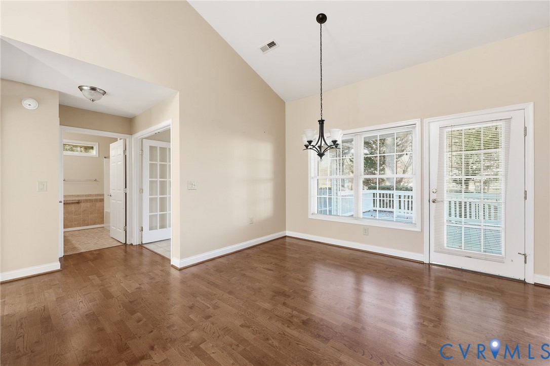 102 Creek Point Court Colonial Heights, VA 23834 - Photo 16 of 45 a view of an empty room with a window and wooden floor