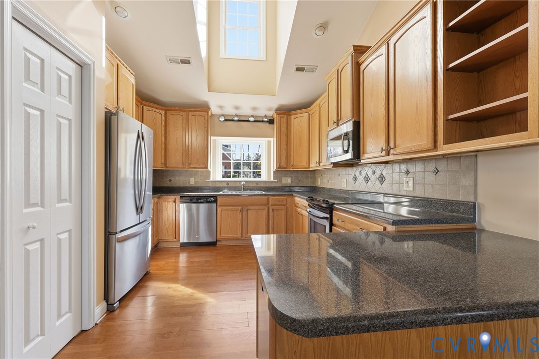 102 Creek Point Court Colonial Heights, VA 23834 - Photo 17 of 45 a kitchen with stainless steel appliances granite countertop a refrigerator a stove and a sink