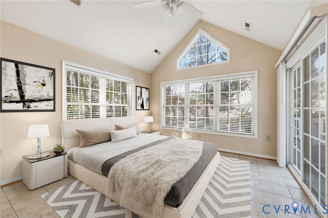 102 Creek Point Court Colonial Heights, VA 23834 - Photo 23 of 45 a bedroom with a large bed and a large window