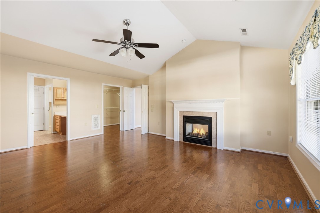 102 Creek Point Court Colonial Heights, VA 23834 - Photo 24 of 45 an empty room with wooden floor a fireplace and windows