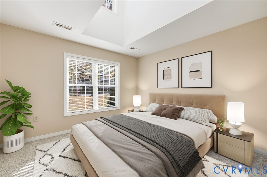 102 Creek Point Court Colonial Heights, VA 23834 - Photo 30 of 45 a bedroom with a bed and a potted plant