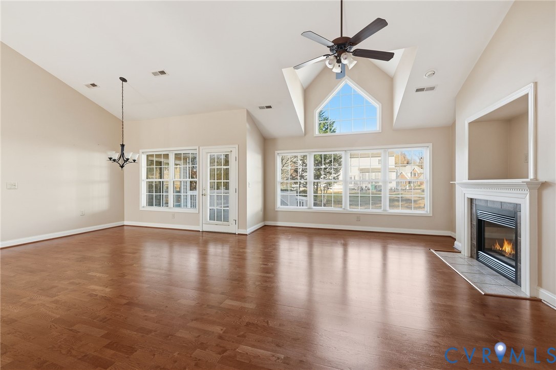 102 Creek Point Court Colonial Heights, VA 23834 - Photo 10 of 45 an empty room with wooden floor fireplace and windows