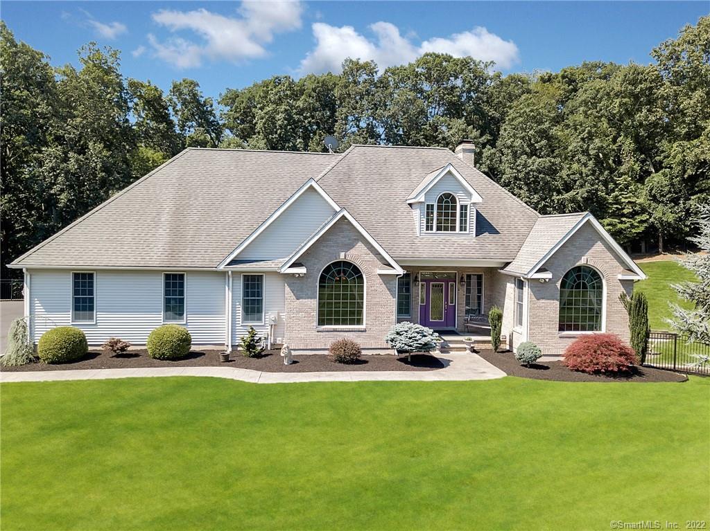21 Tammy Hill Road Wallingford, CT 06492 - Photo 1 of 1 a front view of house with yard outdoor seating and green space