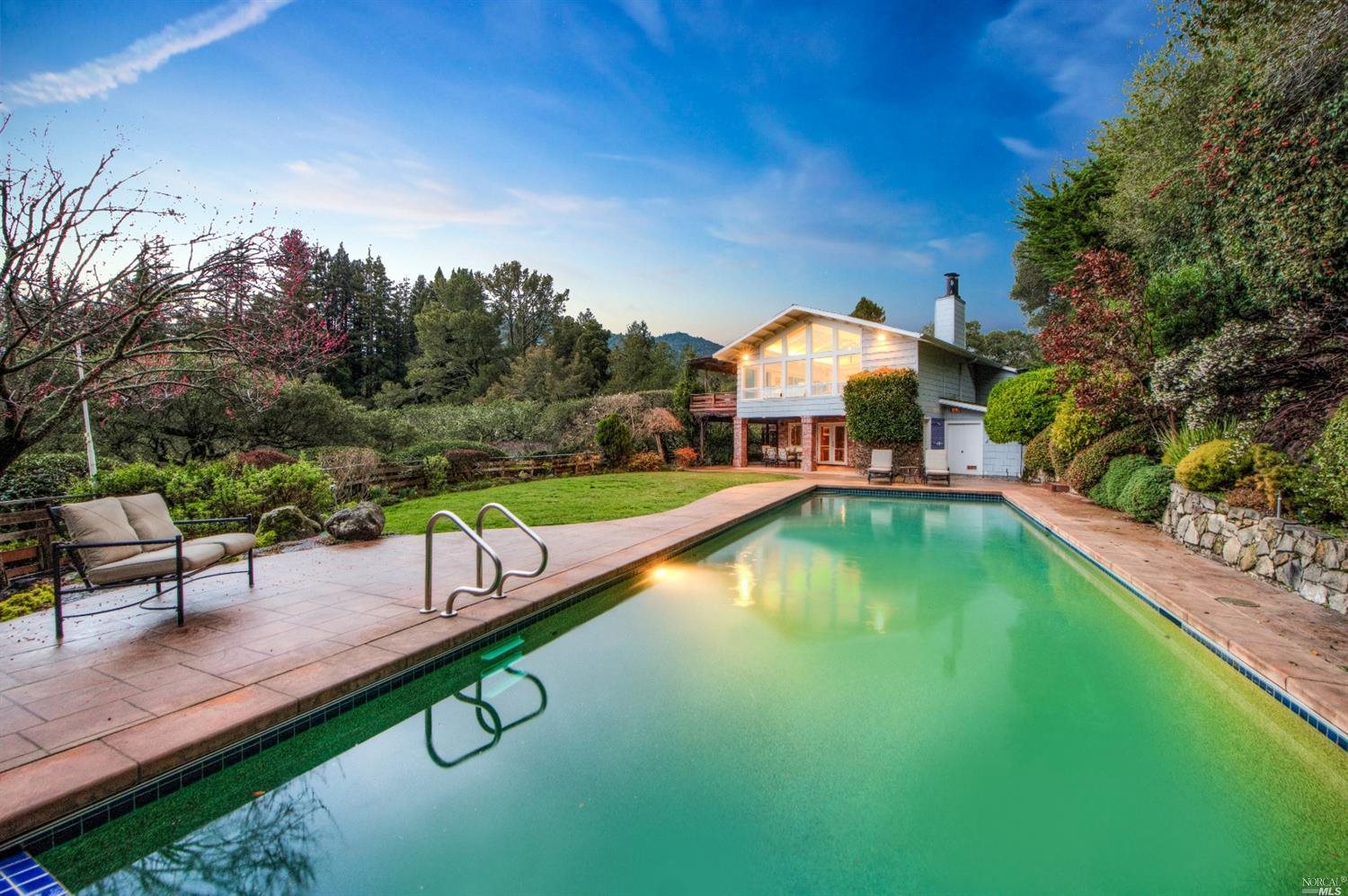 512 Goodhill Road Kentfield, CA 94904 - Photo 1 of 1 a view of a swimming pool with a bench and trees