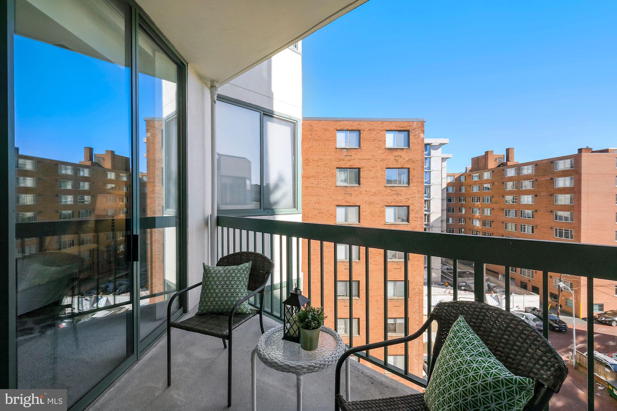 955 26th Street Northwest, Unit 707 Washington, DC 20037 - Photo 14 of 20 a view of a balcony with chairs