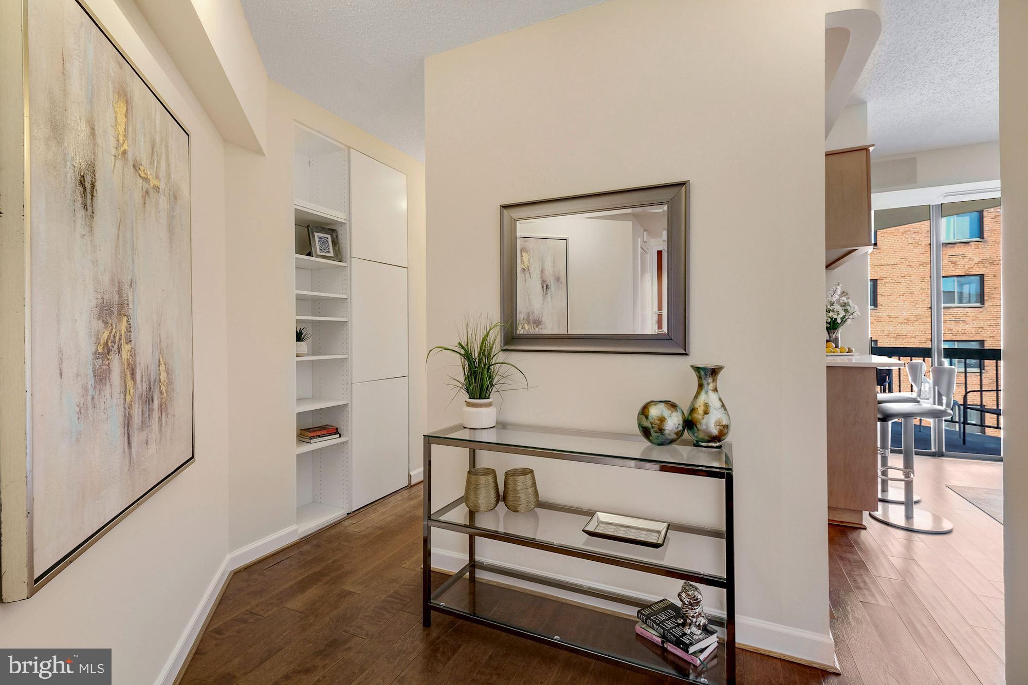 955 26th Street Northwest, Unit 707 Washington, DC 20037 - Photo 3 of 20 a view of hallway with furniture and wooden floor