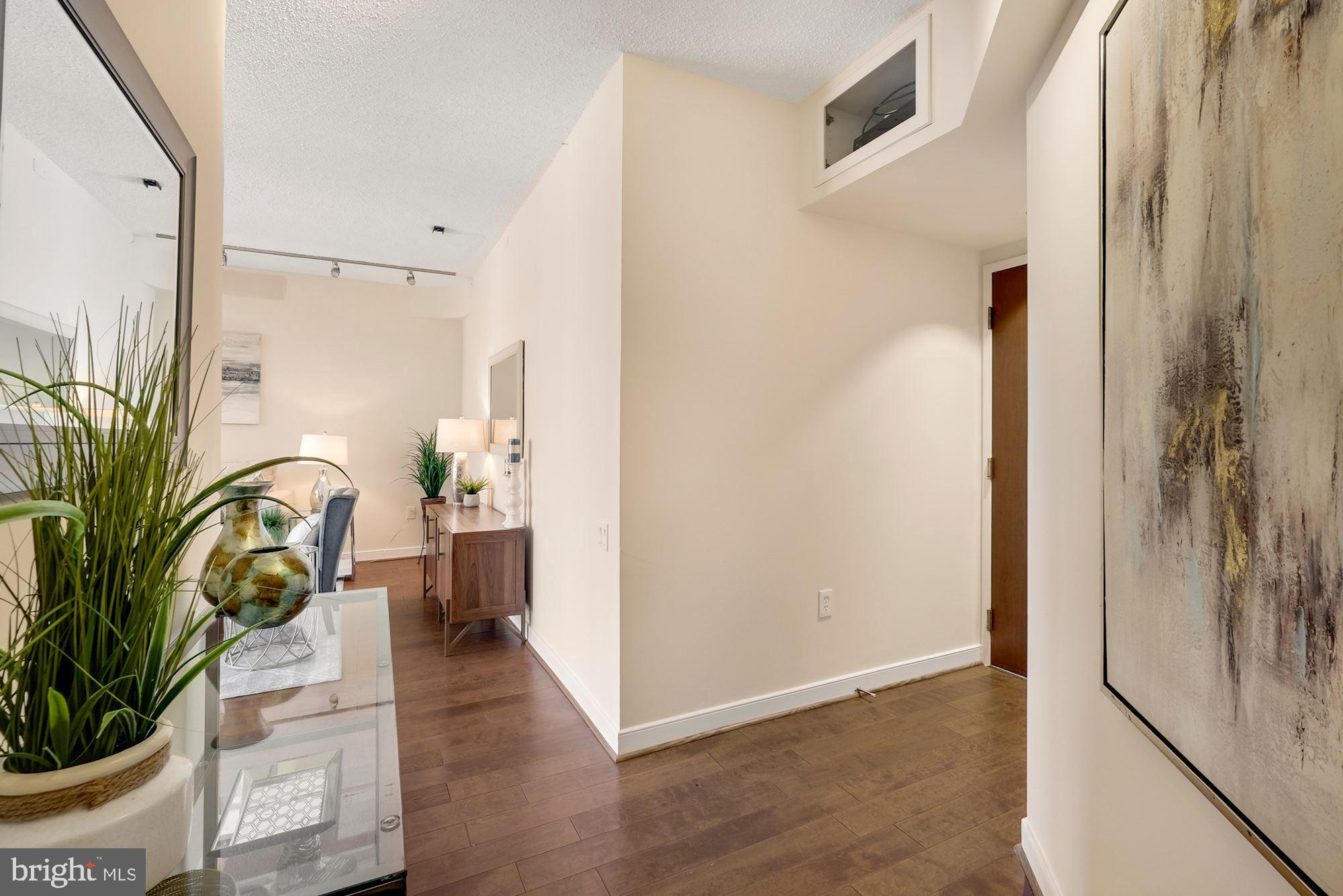 955 26th Street Northwest, Unit 707 Washington, DC 20037 - Photo 5 of 20 a view of entryway with livingroom and furniture