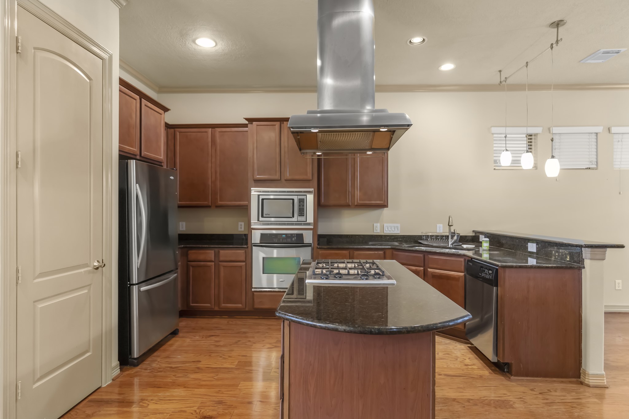 1607 Bass Street, Unit B Houston, TX 77007 - Photo 13 of 39 a kitchen with stainless steel appliances granite countertop a sink stove and refrigerator