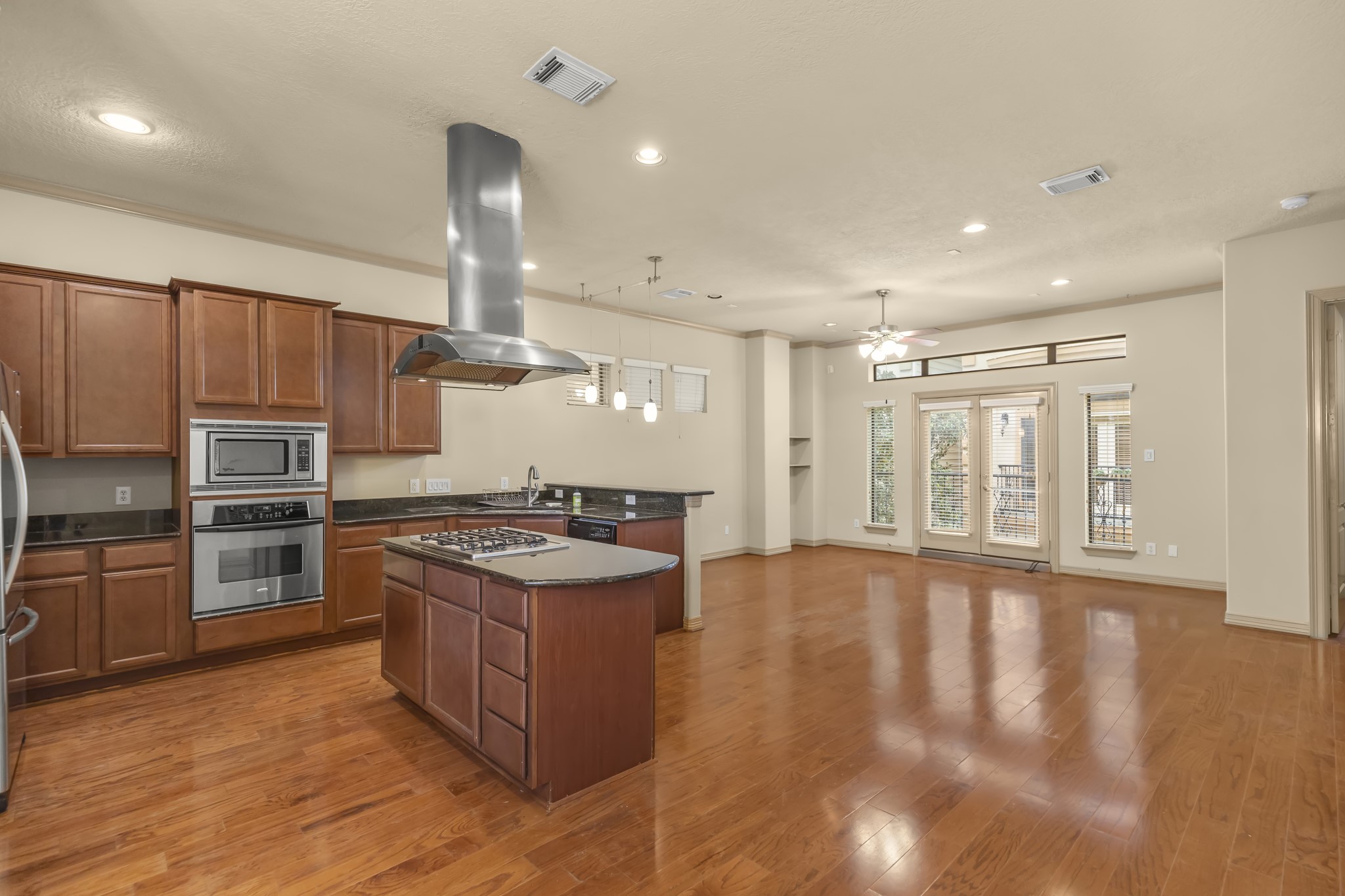 1607 Bass Street, Unit B Houston, TX 77007 - Photo 14 of 39 a kitchen with stainless steel appliances granite countertop a stove and a sink