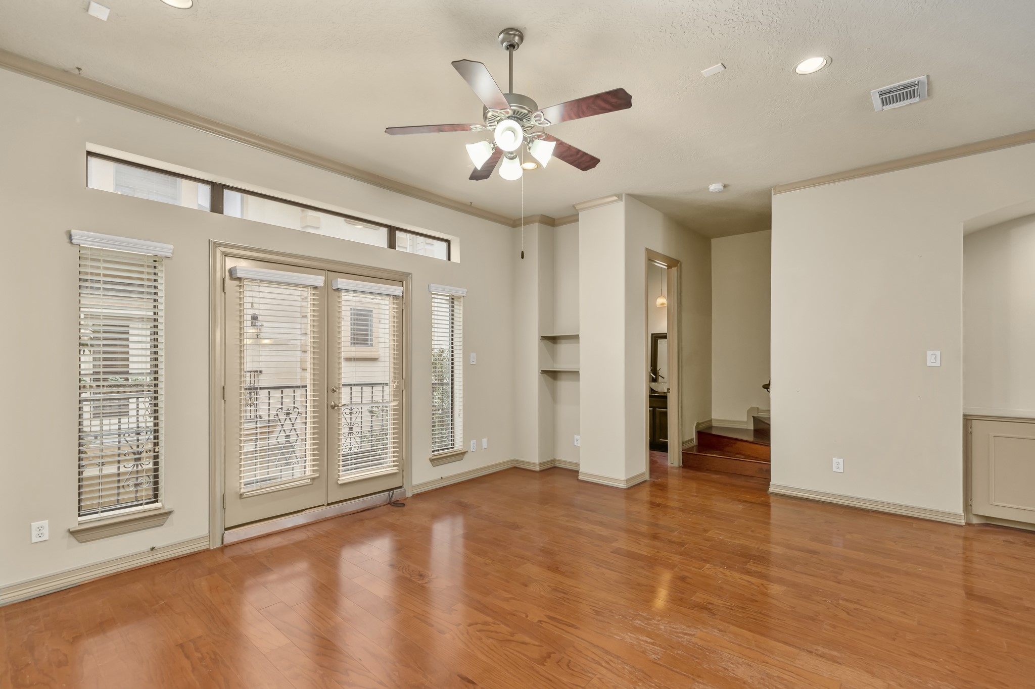 1607 Bass Street, Unit B Houston, TX 77007 - Photo 19 of 39 a view of an empty room with chandelier fan and a window