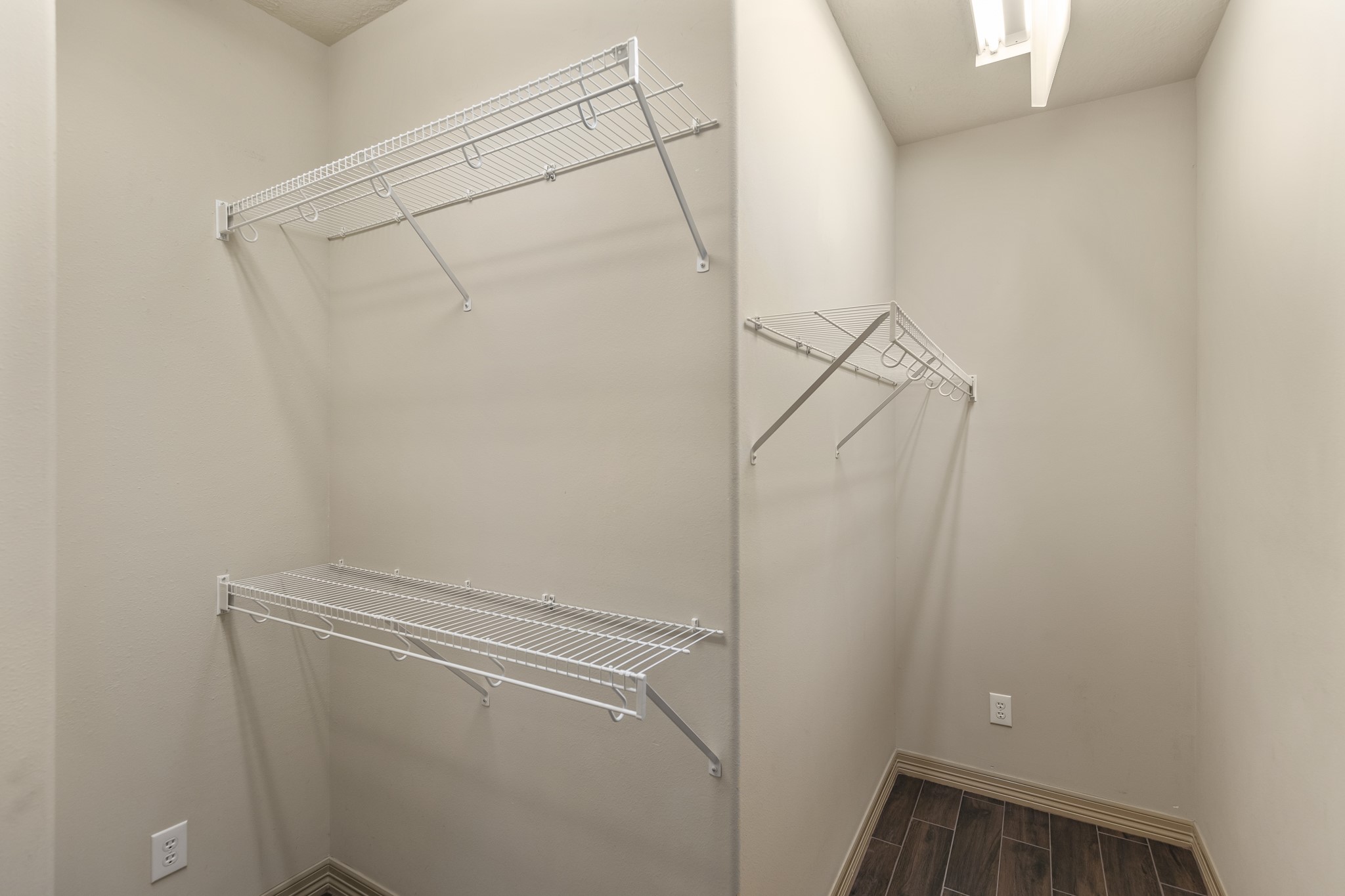 1607 Bass Street, Unit B Houston, TX 77007 - Photo 22 of 39 a view of storage and utility room with racks on the wall