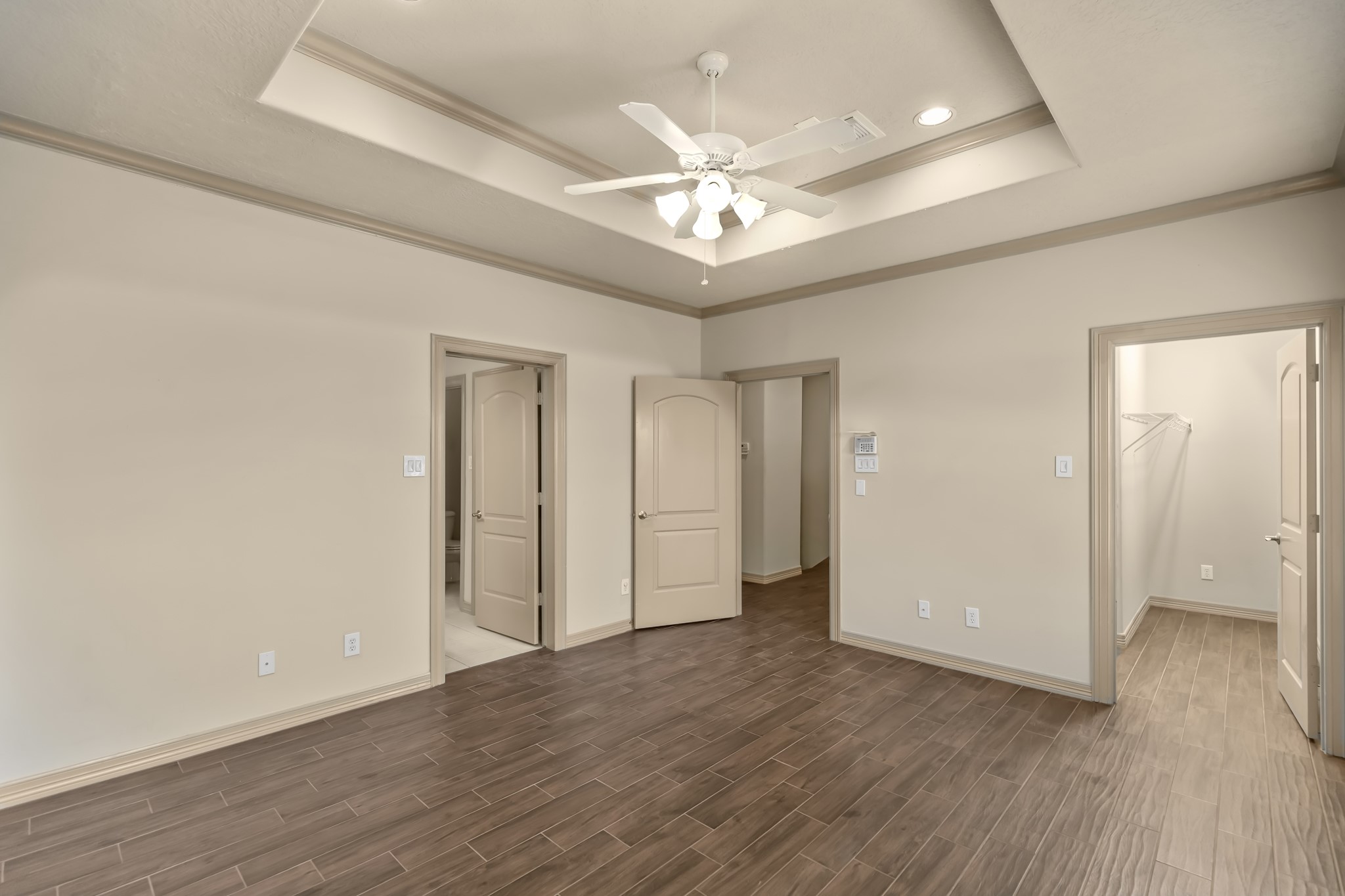 1607 Bass Street, Unit B Houston, TX 77007 - Photo 23 of 39 an empty room with wooden floor and ceiling fan