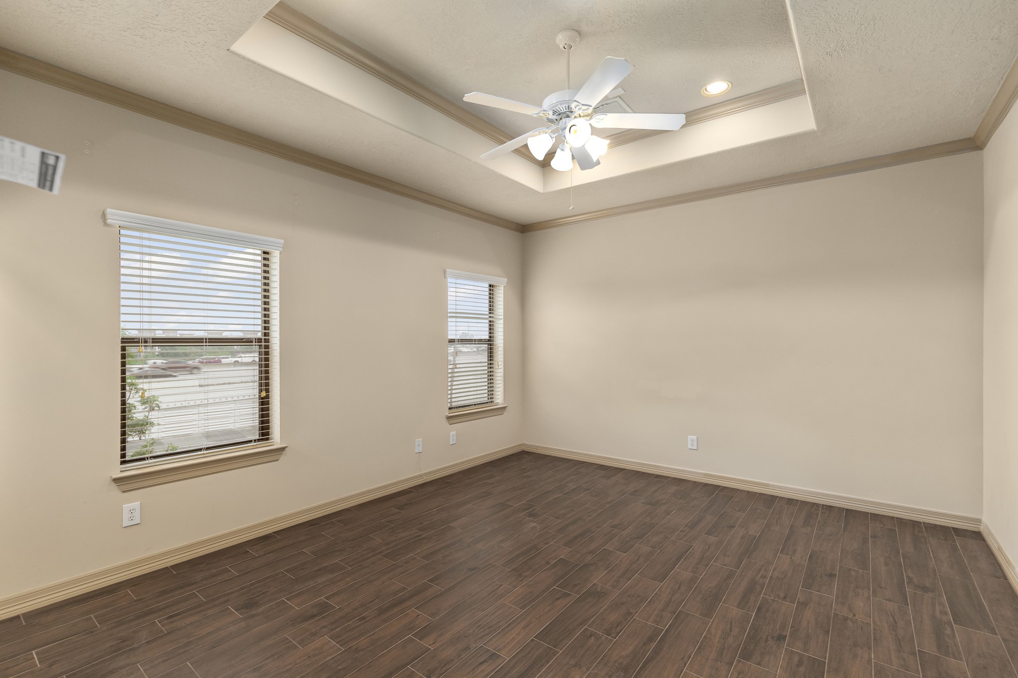 1607 Bass Street, Unit B Houston, TX 77007 - Photo 25 of 39 a view of an empty room with a window and wooden floor
