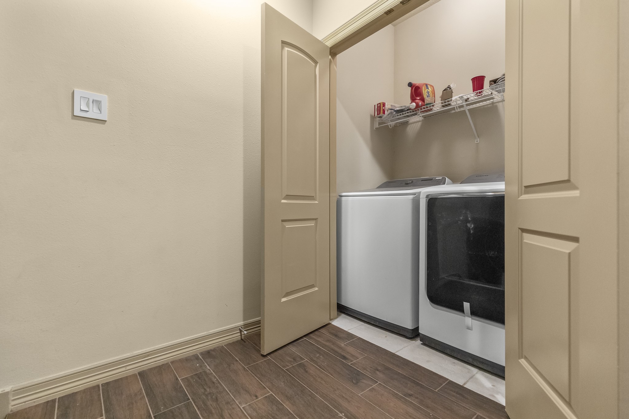 1607 Bass Street, Unit B Houston, TX 77007 - Photo 27 of 39 a view of storage and utility room with wooden floor
