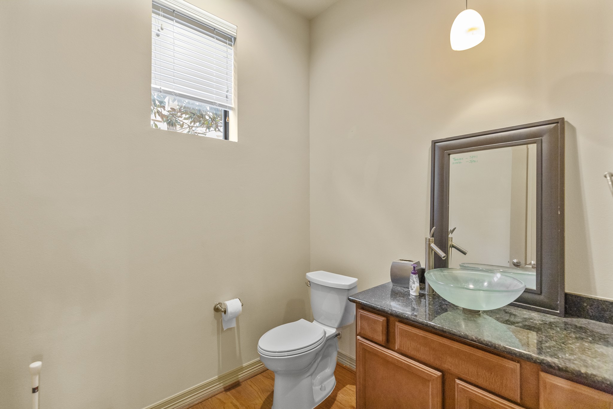 1607 Bass Street, Unit B Houston, TX 77007 - Photo 9 of 39 a bathroom with a granite countertop sink and a mirror