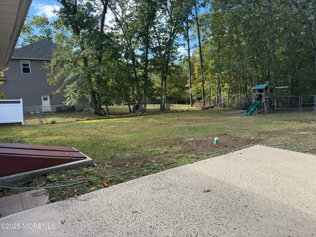 a view of a park with large trees