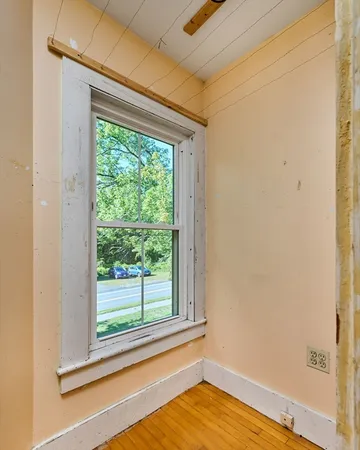 a view of an empty room with a window