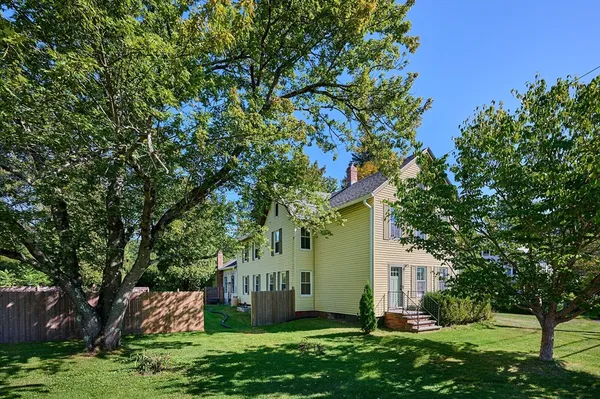 a house with a tree in front of it