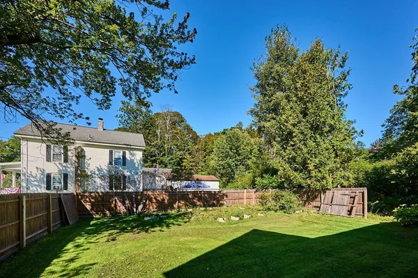 a backyard of a house with lots of green space