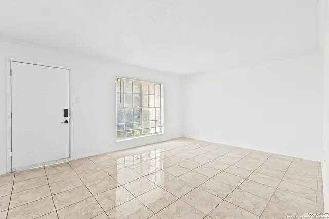 a view of an empty room and window