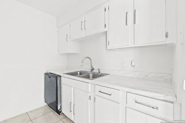 a kitchen with stainless steel appliances a refrigerator and a stove