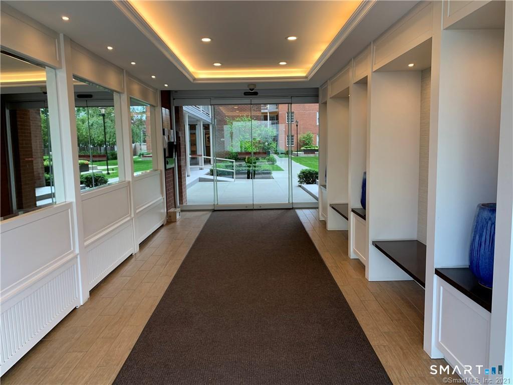 700 Summer Street, Unit 1M Stamford, CT 06901 - Photo 16 of 22 a view of a large room with furniture and a large window