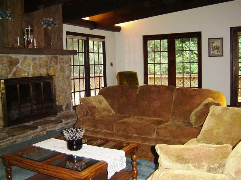 2817 McCully Road Allison Park, PA 15101 - Photo 6 of 23 Great Room. This large room is open to the kitchen area although separated by a half wall. A stone wood burning fireplace flanks the outside wall. Lots of light is available through the many French doors that open to the deck outside.