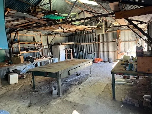 a view of a chairs and table in the patio
