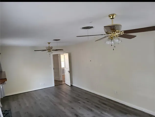 a view of a room with a hardwood floor