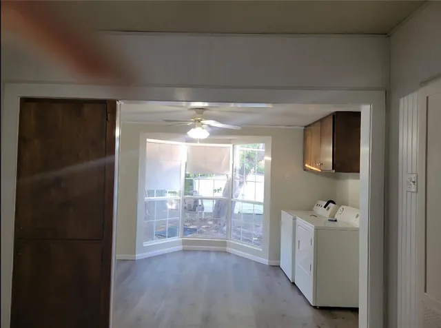 a bathroom with a tub shower and sink