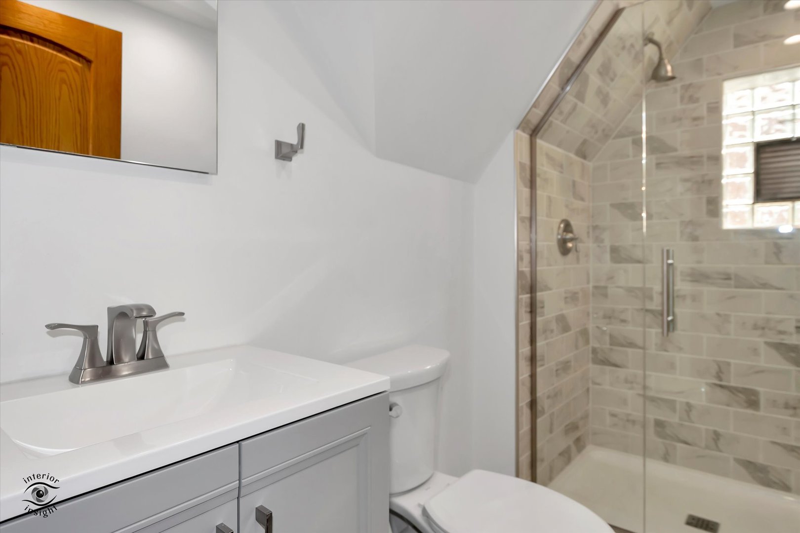 2546 West 110th Street Chicago, IL 60655 - Photo 17 of 26 a bathroom with a sink a toilet and shower