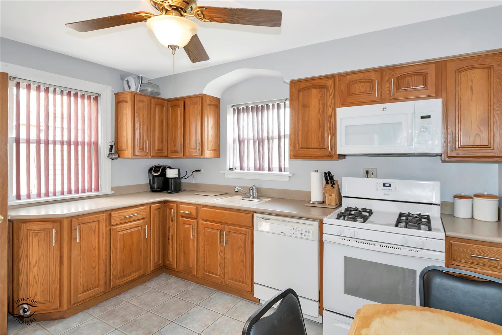 2546 West 110th Street Chicago, IL 60655 - Photo 9 of 26 a kitchen with a sink cabinets and window
