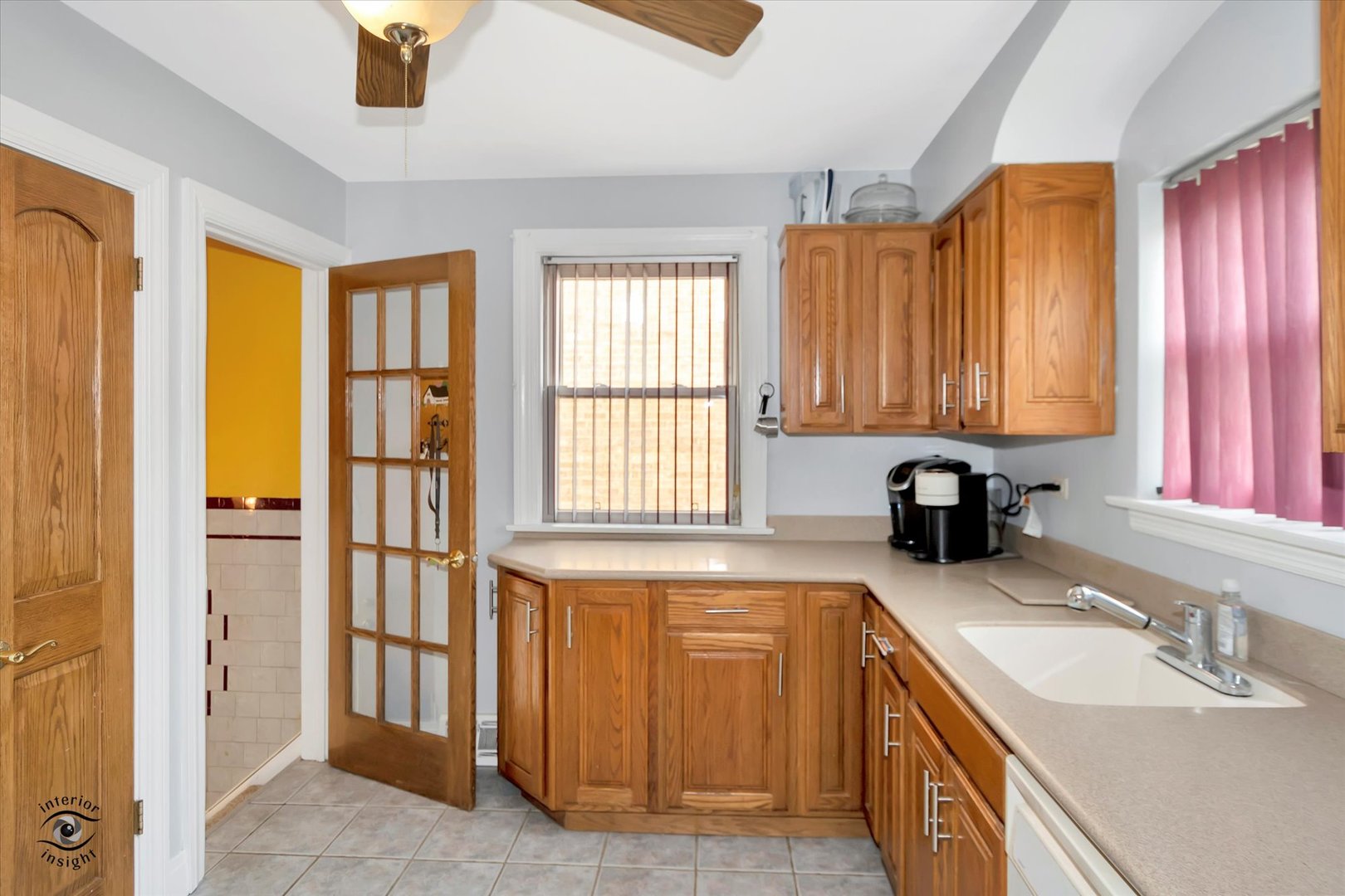 2546 West 110th Street Chicago, IL 60655 - Photo 10 of 26 a view of a kitchen with granite countertop a sink and a window