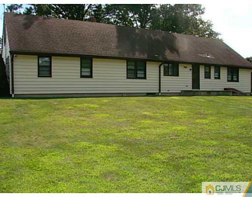 422 Ridge Road Dayton, NJ 08810 - Photo 18 of 24 a front view of a house with a garden