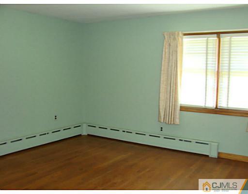 422 Ridge Road Dayton, NJ 08810 - Photo 23 of 24 an empty room with a window