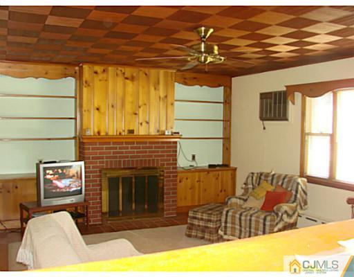 422 Ridge Road Dayton, NJ 08810 - Photo 4 of 24 a view of a living room with furniture