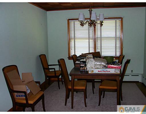 422 Ridge Road Dayton, NJ 08810 - Photo 10 of 24 a view of a dining room with furniture and window