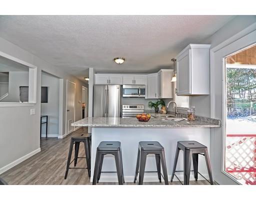 19 Ramshorn Road Dudley, MA 01571 - Photo 6 of 29 a kitchen with refrigerator and cabinets