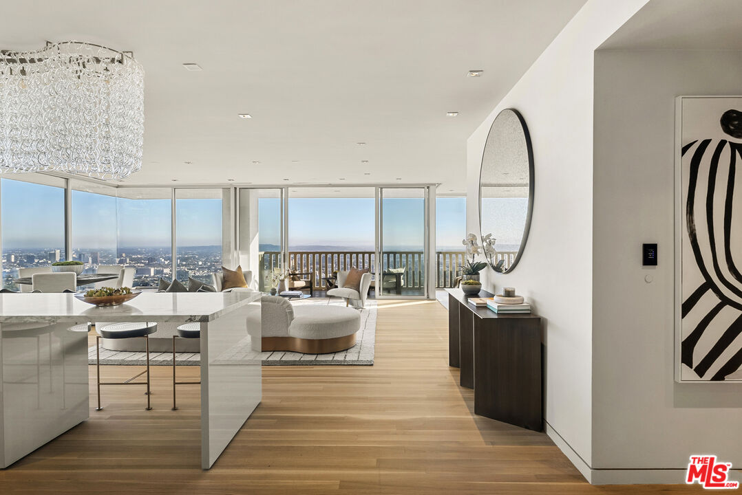 a living room with lots of furniture and a wooden floor