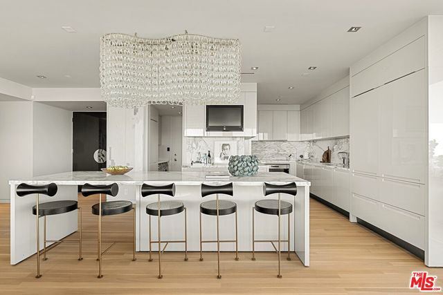 a living room with furniture a wooden floor and a fireplace