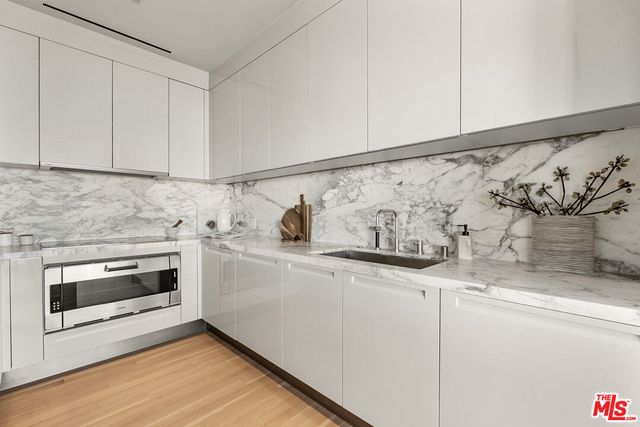 a utility room with cabinets
