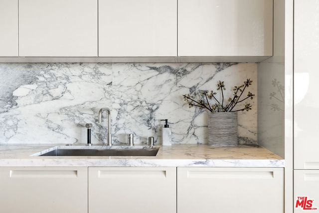 a view of a sink a mirror