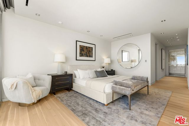 a bathroom with a double vanity sink mirror and shower