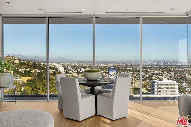 a view of a dining table chairs in the balcony