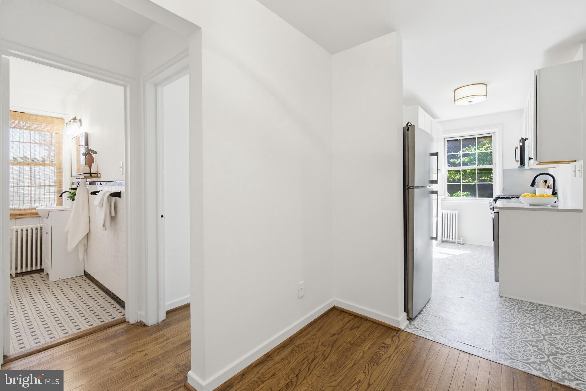 2214 Colston Drive, Unit 201 Silver Spring, MD 20910 - Photo 16 of 43 a view of a kitchen from the hallway