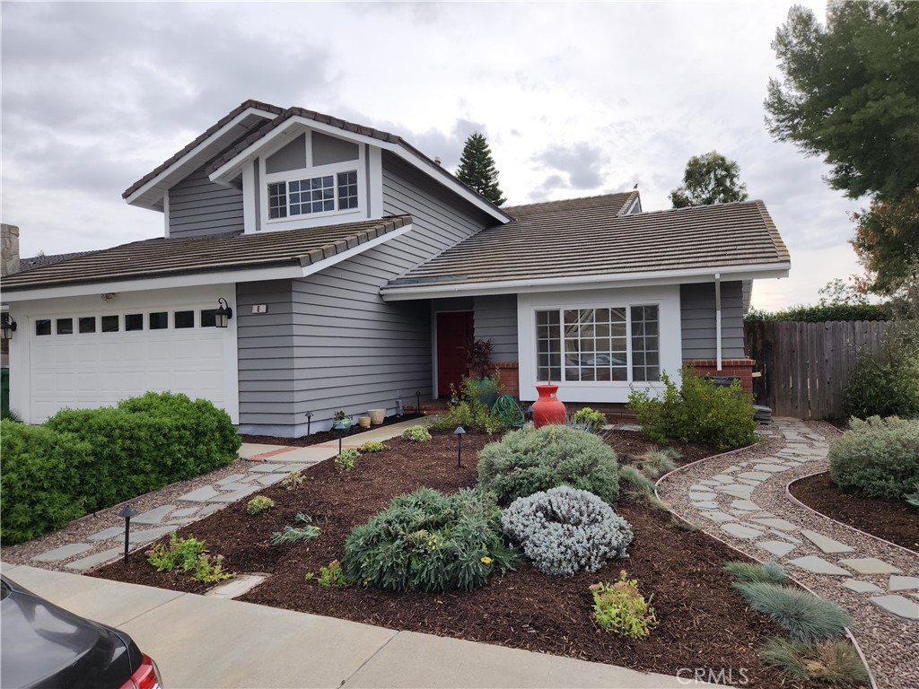 6 Stonewall Irvine, CA 92620 - Photo 1 of 1 a front view of a house with a yard and potted plants