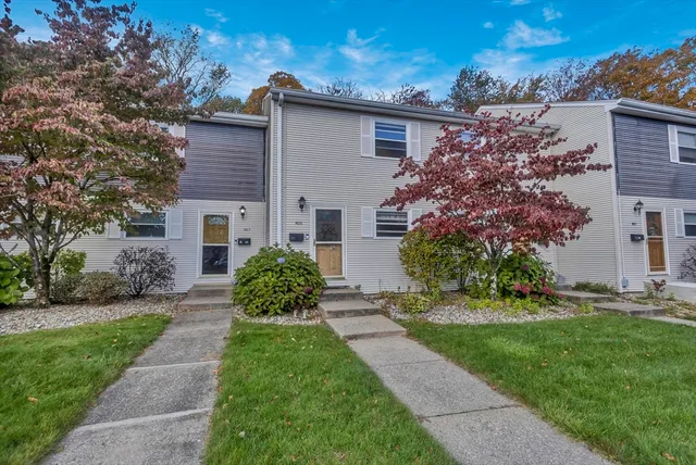 front view of a house with a yard